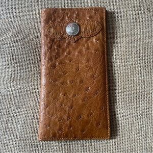 Long Wallet Brown man made material exterior leather interior 7 1/4” x 3 1/2”
